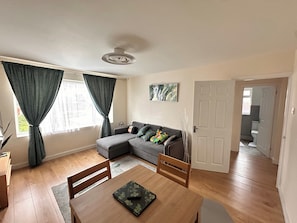 Apartment | Living area | Flat-screen TV - 2 Bedroom Apartment-sleeps 6-parking-wifi (Grays)