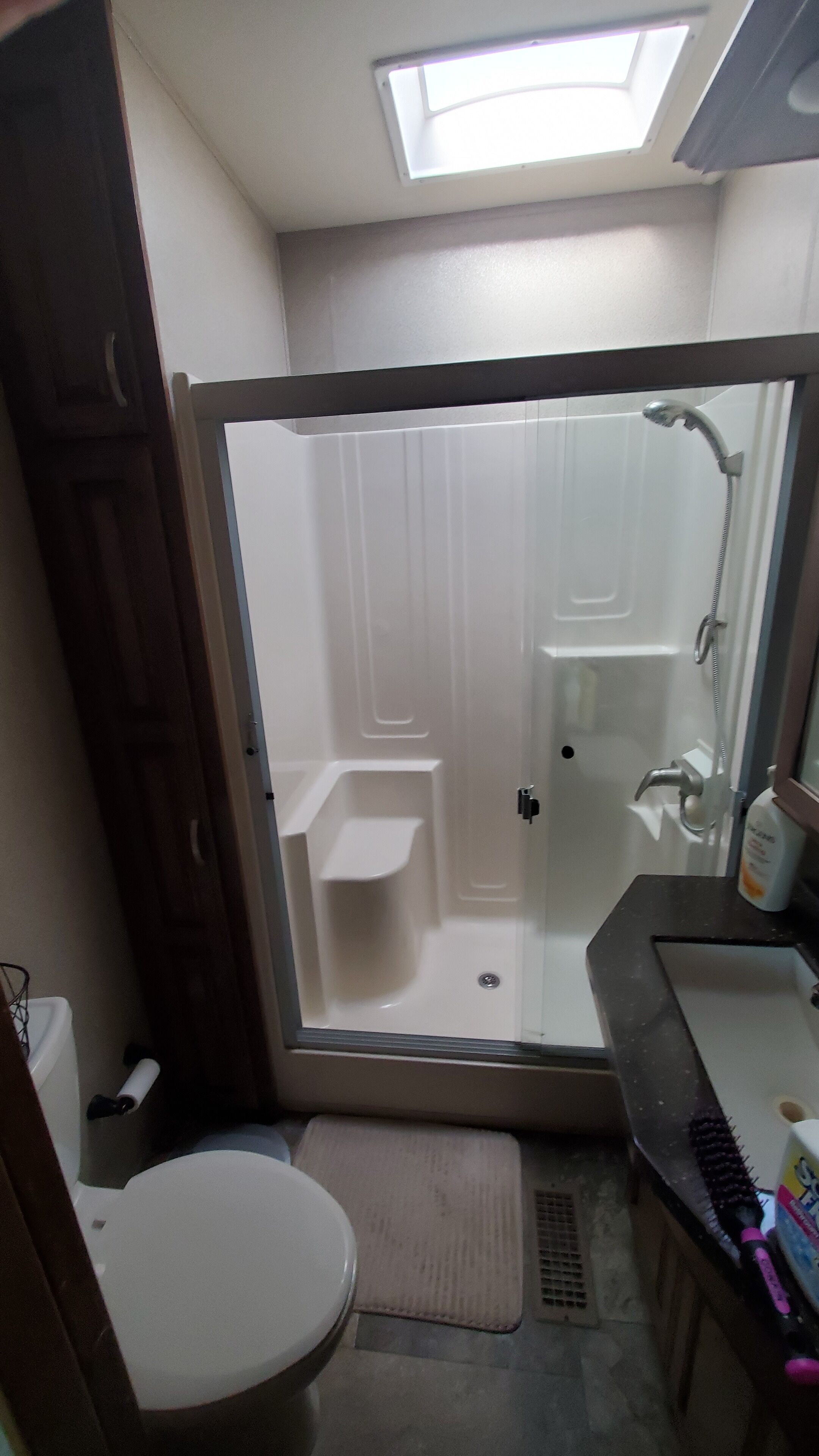 Shower, hair dryer, towels, toilet paper