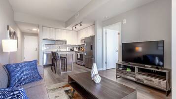 Luxury Apartment, Balcony | Living area | Smart TV