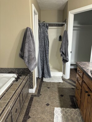 Shower, jetted tub, towels, soap