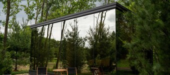 Luxurious mirrored cabin nestled on the Woods & Co Weddings + Events property for the ultimate getaway