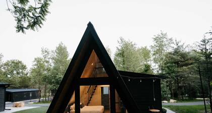 Pine- A-frame cabin nestled on the Woods & Co Weddings + Events property