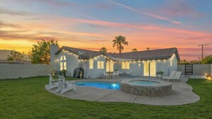 A house with a swimming pool, outdoor seating, and a sunset view. - Spacious, Bright 4-Bedroom Home with Mountain Views, Private Pool, and Hot Tub  (Palm Springs)