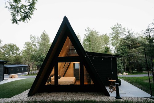 Birch A-frame cabin nestled on the Woods & Co Weddings + Events property