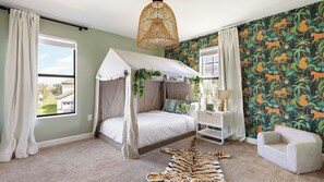 A bedroom with a canopy bed, a zebra rug, and a jungle-themed wall. - Sleeps 18! Family Retreat w/ Game Room, Pool, Resort Access Shadow Mountain (Davenport)