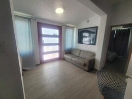 Apartment, 3 Bedrooms, Beachside | Living area | 55-inch LED TV with digital channels
