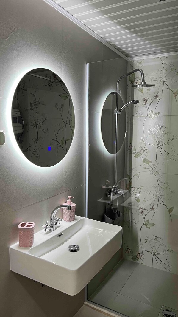 Shower, hair dryer, towels, soap