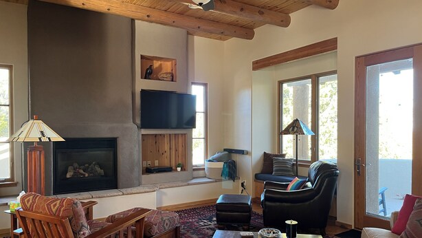 A cozy living room with a fireplace, wooden ceiling, and comfortable seating. - Quiet Retreat w/ Jacuzzi Tub and Fire Pit in Beautiful Prescott! (Prescott)