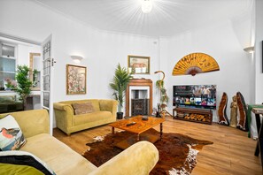 Relax in this inviting living room with a comfortable sofa set, coffee table, and decorative items.