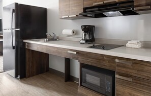 Full-size fridge, microwave, stovetop, toaster