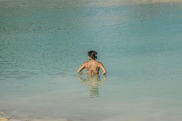 A person standing in shallow water.