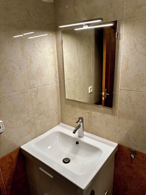 Shower, towels, soap, toilet paper