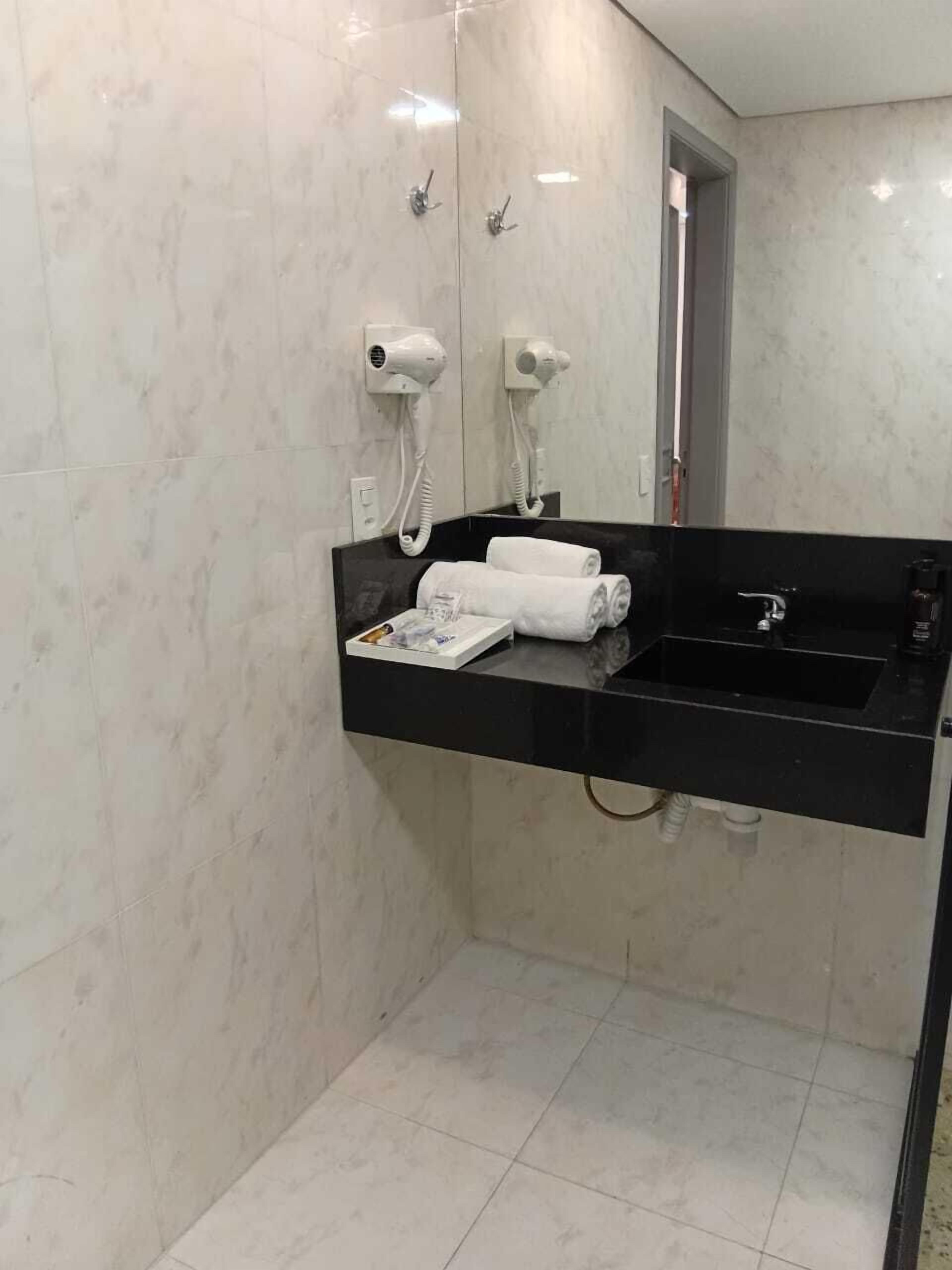 Separate bathtub and shower, hair dryer, bathrobes, slippers