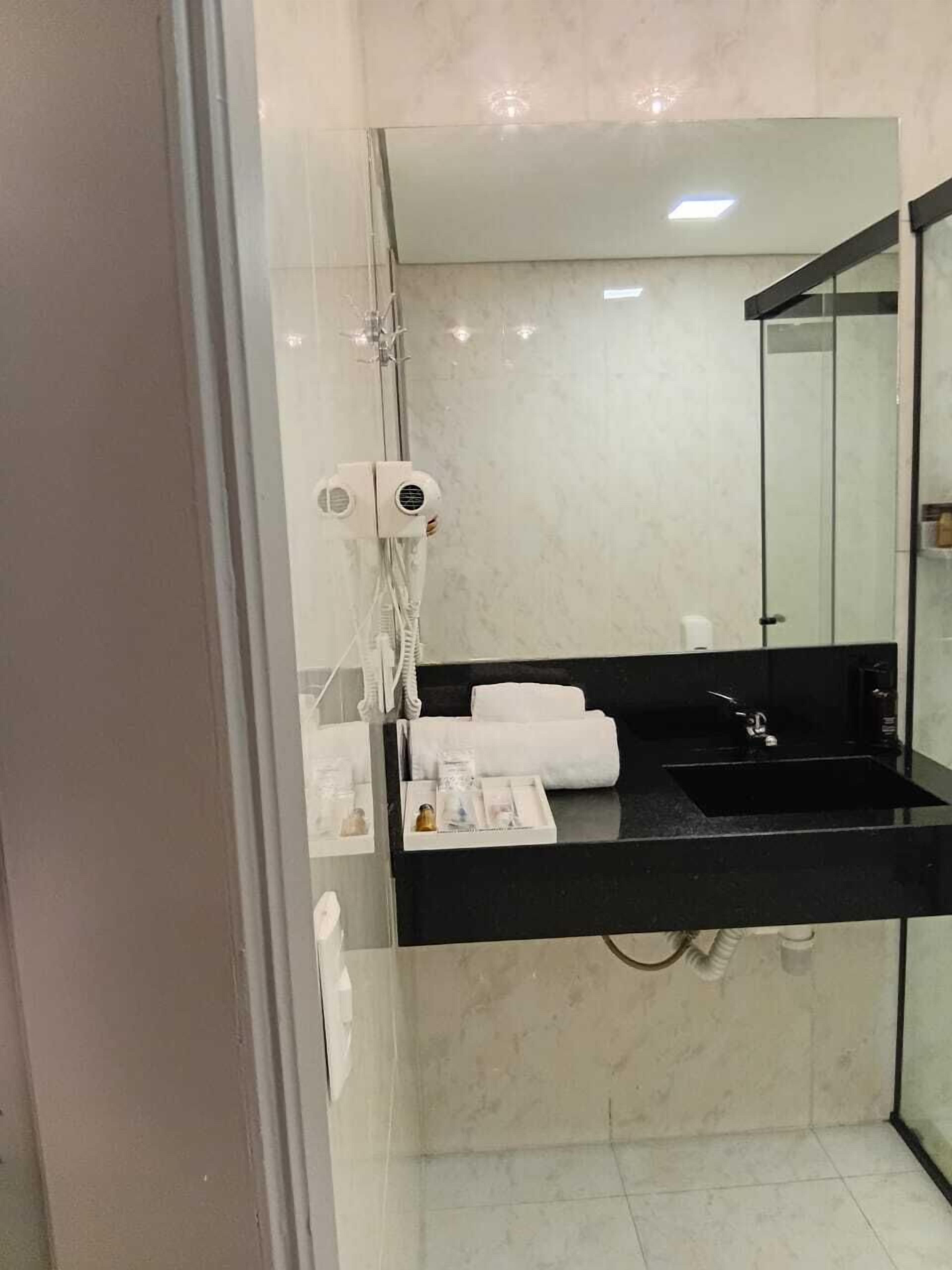 Separate bathtub and shower, hair dryer, bathrobes, slippers