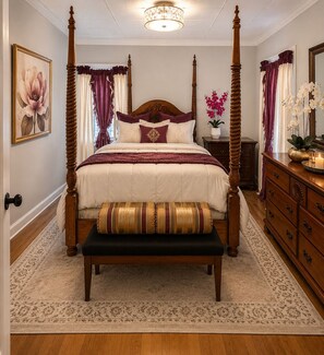 A four-poster bed with a bench, a nightstand, a dresser, and a chandelier. - Fall River Stay Stylish 2BR • Free Parking (Fall River)
