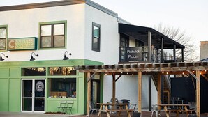 A two-story building with a green storefront labeled "Culture Counter" and a sign for "Pickwick Places." - Pickwick Places 202 MSU/Rountree (Springfield)