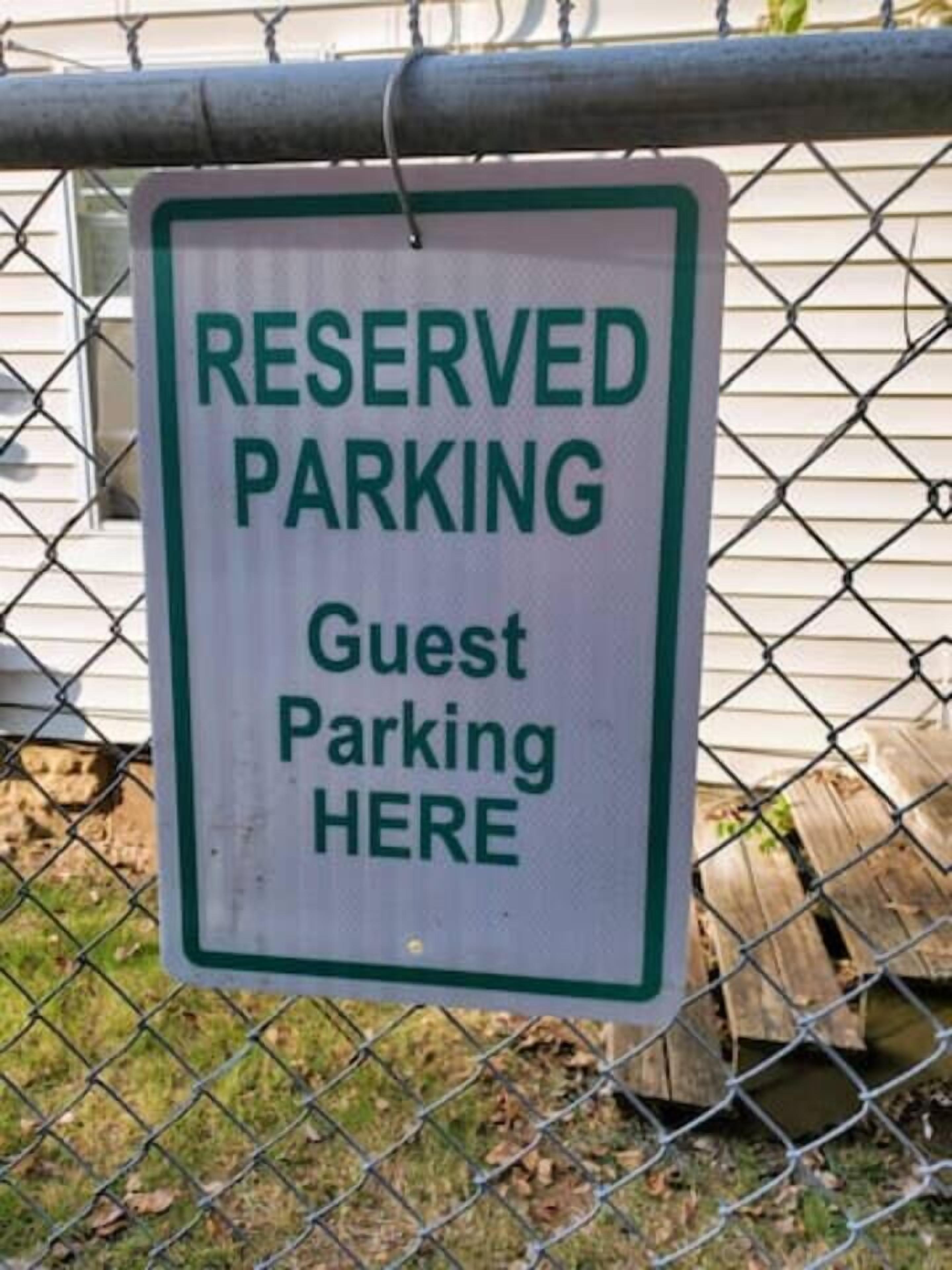A sign indicating reserved parking for guests.