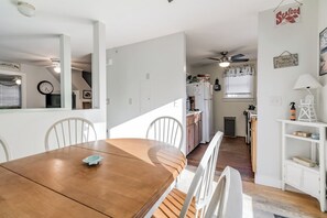 Cozy living space with a dining area, kitchen, and modern appliances.