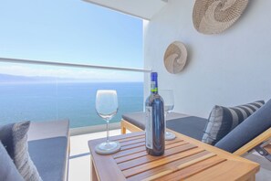 Outdoor dining - Luxury 3-Bedroom Beachfront Condo at Harbor 171 with Pools, Gym, and much more! (Puerto Vallarta)
