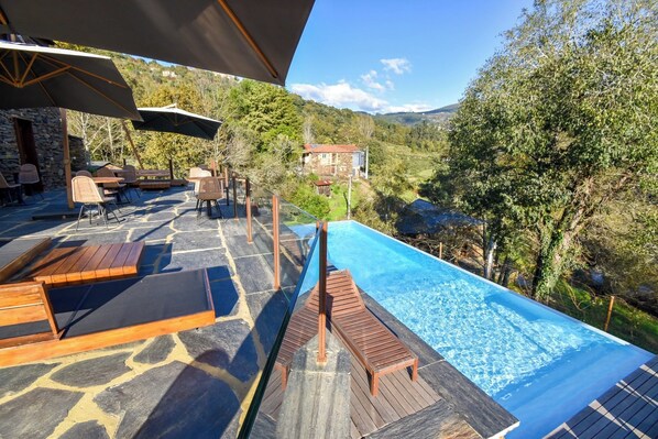 Outdoor pool, open 9:30 AM to 5:30 PM, pool umbrellas, sun loungers