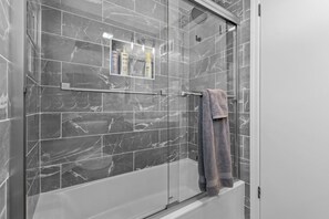 Shower, towels, soap, toilet paper