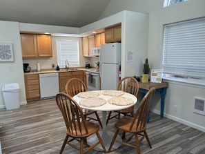 Fridge, microwave, coffee/tea maker, cookware/dishes/utensils