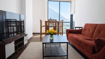 Executive Apartment, Balcony, Mountain View | Living area | Smart TV, streaming services