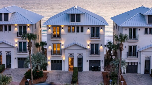A beachfront hotel with three-story buildings, a central entrance with a covered porch, and a view of the ocean. - 🌊 Serenity by the Sea | Beach Front | FREE Pool Heating | Elevator & FREE Excursions (Miramar Beach)