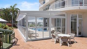 Indoor pool, outdoor pool, pool umbrellas