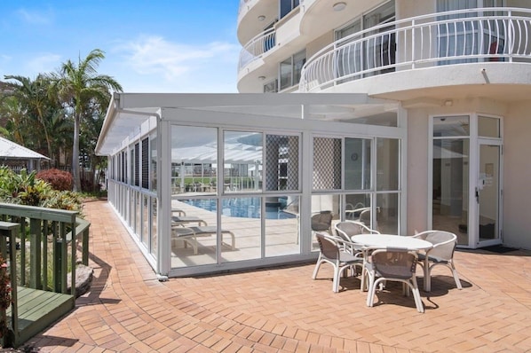 Indoor pool, outdoor pool, pool umbrellas