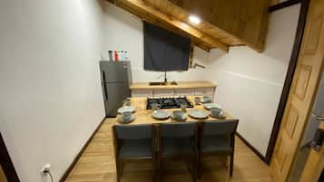 Fridge, stovetop, electric kettle, cookware/dishes/utensils