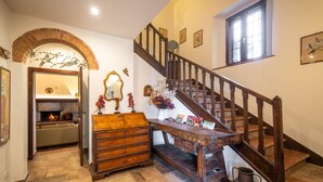 A staircase with wooden railings leading to an upper floor.