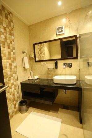 Deluxe Double Room | Bathroom | Rainfall showerhead, free toiletries, hair dryer, bathrobes - The Exotica Grandeur (New Delhi)