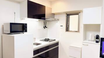 Fridge, microwave, coffee/tea maker, cookware/dishes/utensils