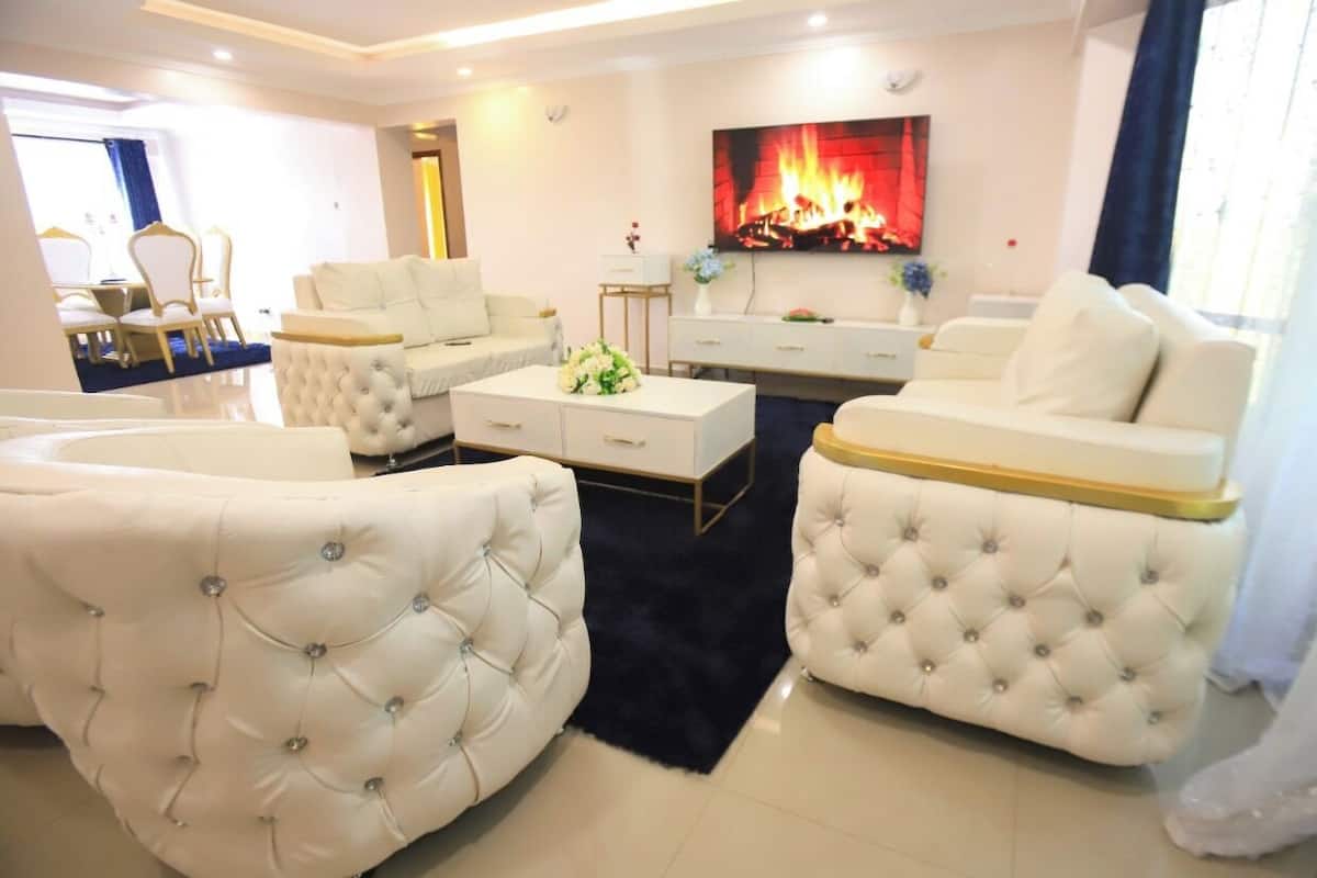 Luxury Apartment | Living area | 24-inch Smart TV with digital channels