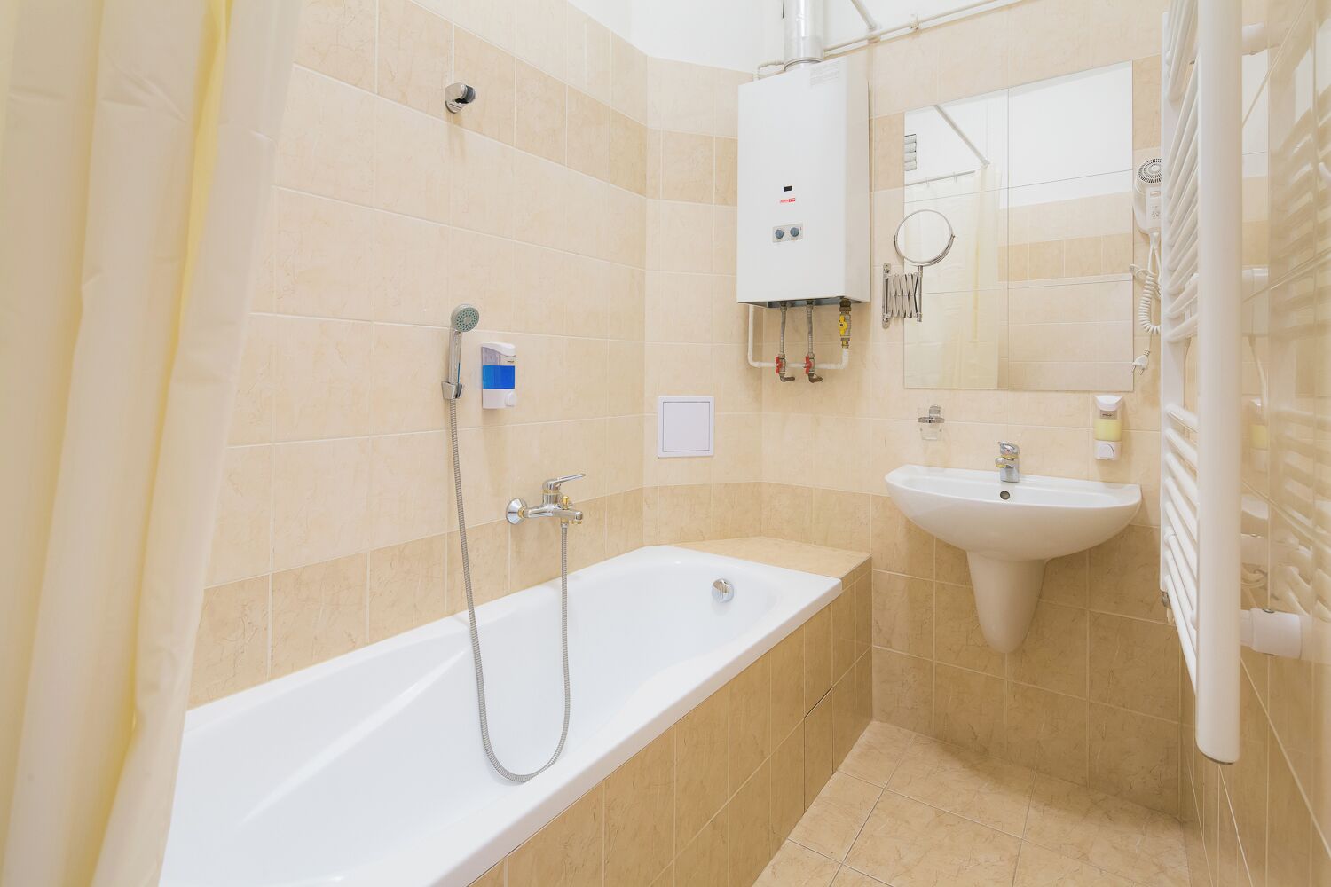 A modern bathroom with a bathtub, a sink, and a shower.