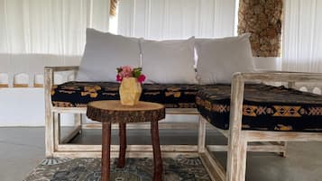 Deluxe Suite, Courtyard View | Living area | TV