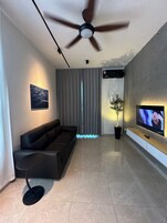 Comfort Apartment, Balcony, City View | Living area | 43-inch Smart TV with digital channels