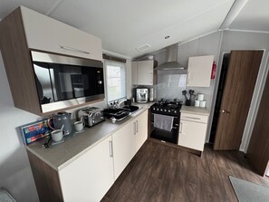 Apartment | Private kitchen | Fridge, microwave, oven, stovetop - Haggerston Castle - Caravan - Sleeps 6 - Parking (Berwick-upon-Tweed)