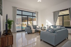 TV - Serene 3BR Villa with Private Pool in Al Dana Island, Fujairah by Deluxe Holiday Homes (Fujairah)
