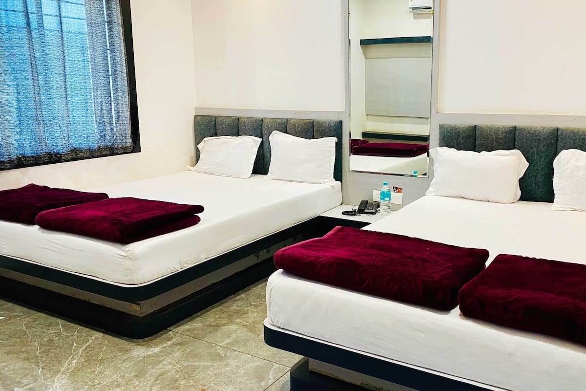 Deluxe Quadruple Room, City View | Soundproofing, free WiFi