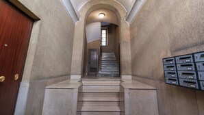 A staircase leading to a door with a mailbox on the right. - Newly renovated apartment in the heart of Rome. (Roma)