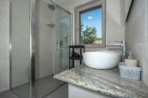 Shower, hair dryer, towels, soap