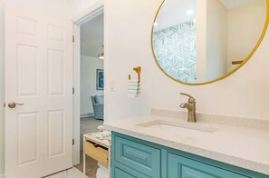 Shower, hair dryer, towels, shampoo