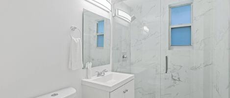 Shower, hair dryer, towels