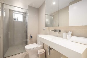Shower, hair dryer, towels, shampoo