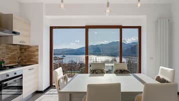 Fridge, stovetop, highchair, cookware/dishes/utensils