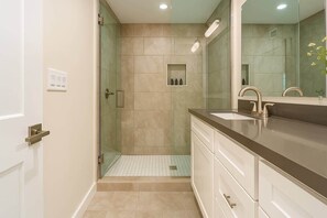 Shower, hair dryer, towels, shampoo