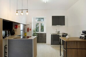 Fridge, microwave, stovetop, coffee/tea maker