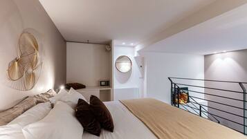 Appartement | Literie de qualité, couette en duvet, fer et planche à repasser